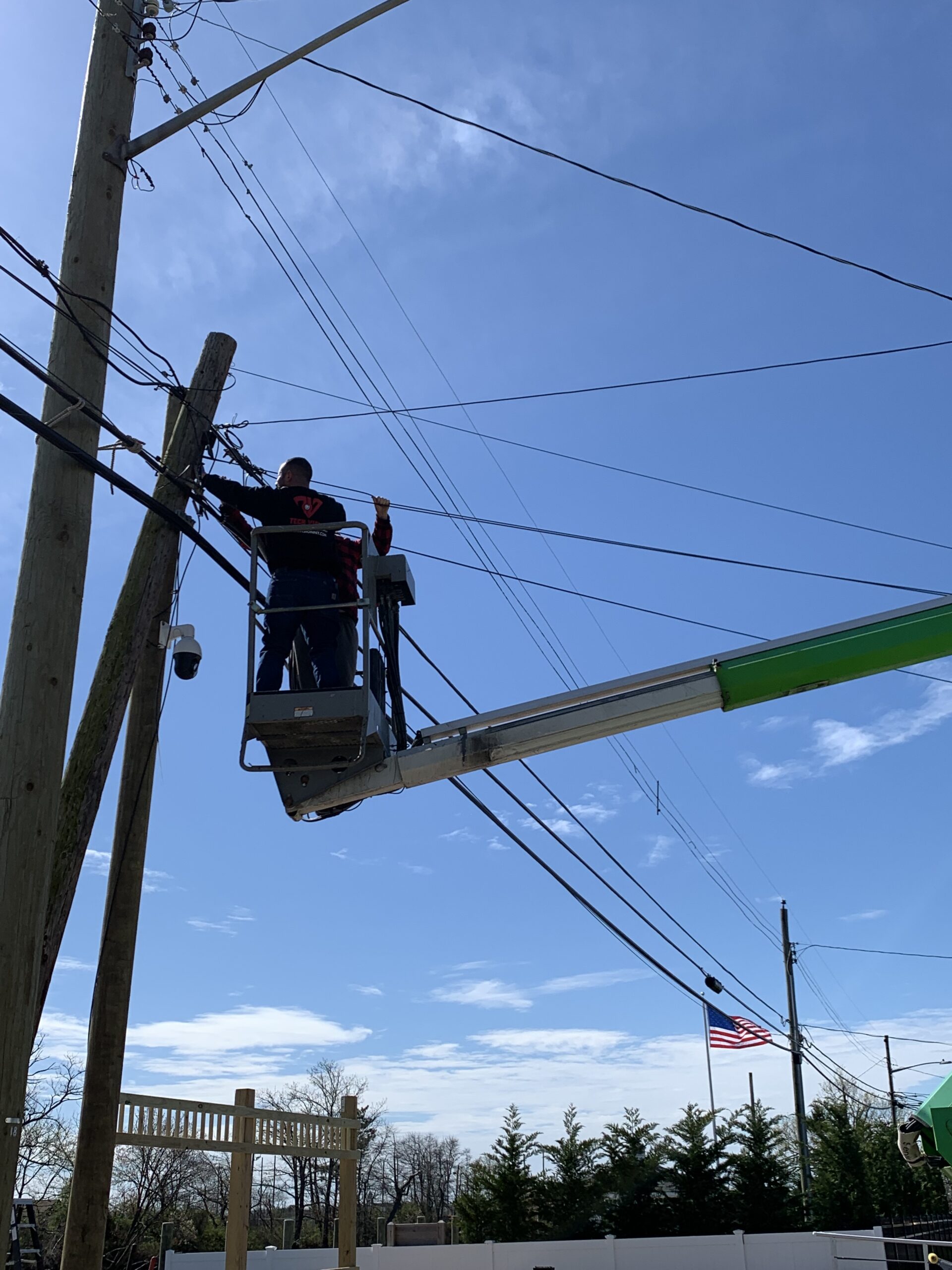 Tech Vision NY technician installing surveillance camera on Long Island